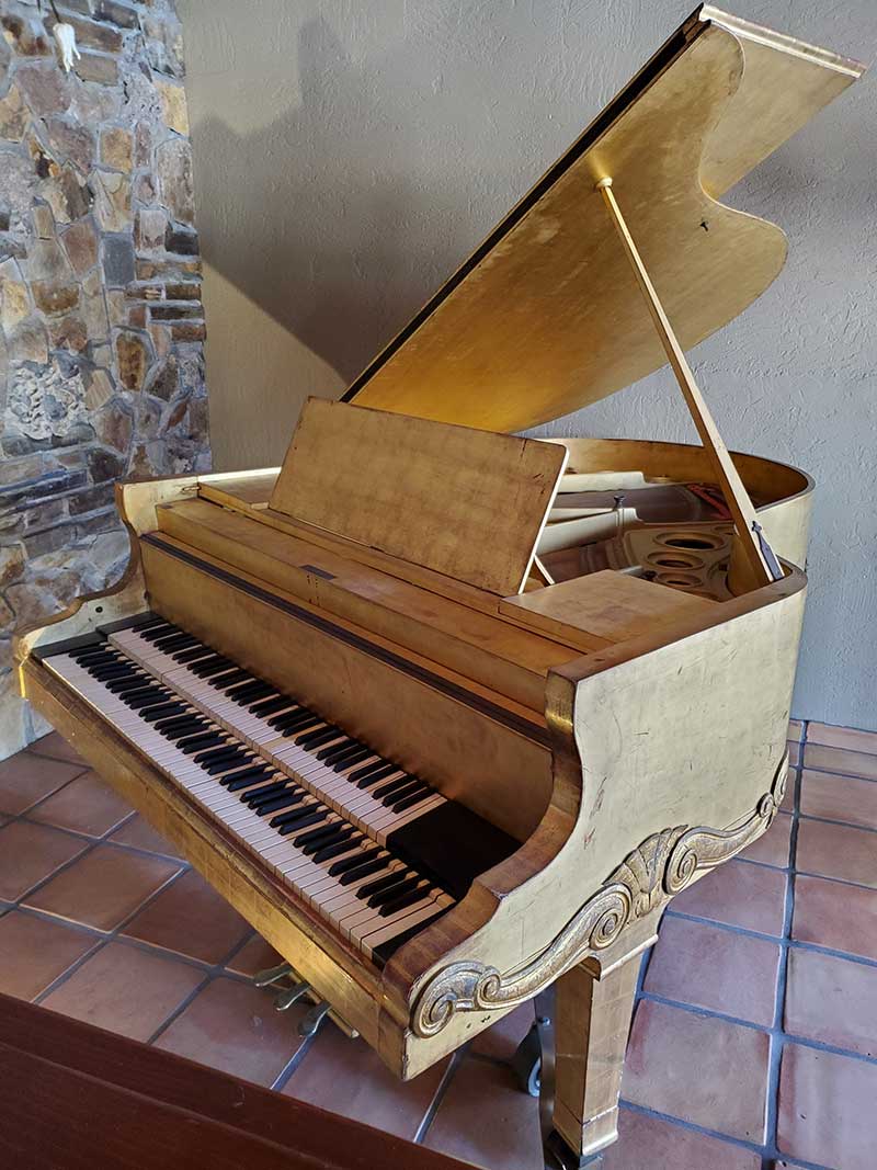 The gold leaf Wendl double keyboard piano, c. 1910, was probably made for Austrian royalty, acquired by Liberace in 1952.