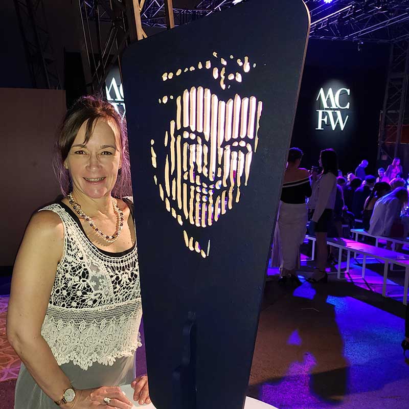 Susan Liberace of Philadelphia with sculpture of Liberace by artist Marcos Marin of Monte Carlo, at Monte Carlo Fashion Week, 2019. Photo by Jonathan Warren