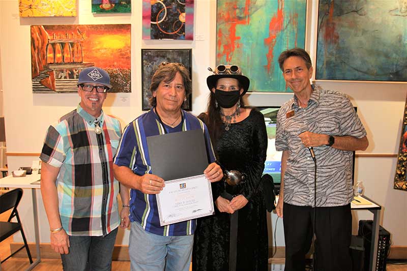 Awards Presentation Left to right: Brian Paco Alvarez - Honorable Judge, Mike B. Davis - Best in Show Winning Artist, Jacie Urquidi-Maynard - LVAG President and Jeffrey Oldham - LVAG Director