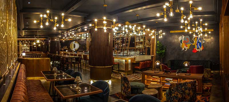 The striking bar lounge area at Barry’s Downtown Prime features custom wall coverings, marble surfaces, and a gold ceiling. Photo courtesy of Pathfinder Productions