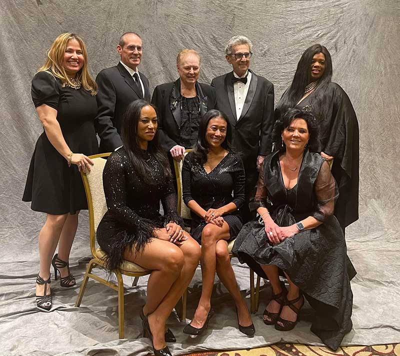 Left to right (back row): Dolores Campuzano-Pignatello, Norman Beland Jr., June Beland, Norman Beland, Capucine Holmes Left to right (front row): Summer Webb, Patricia Lee, Berenice Church 