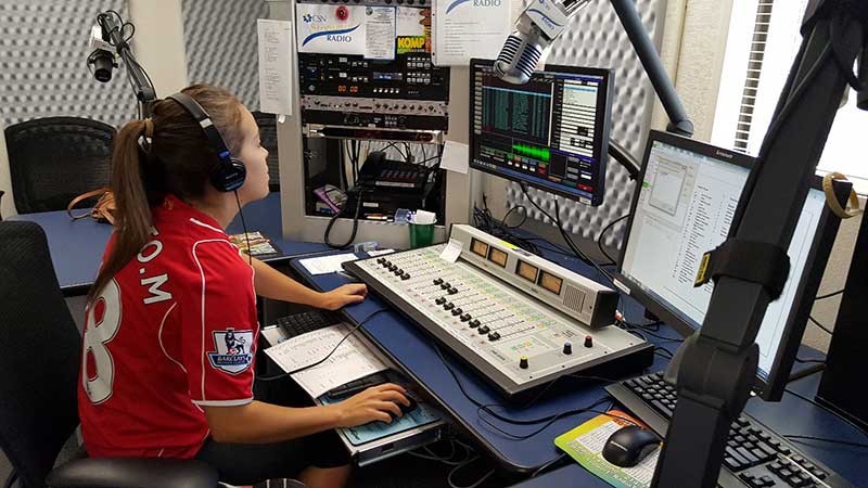 Working inside the campus broadcasting studio.