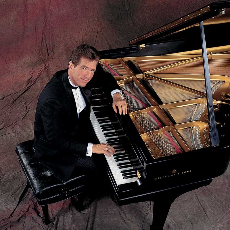 David Osborne at a Steinway & Sons Grand Piano.