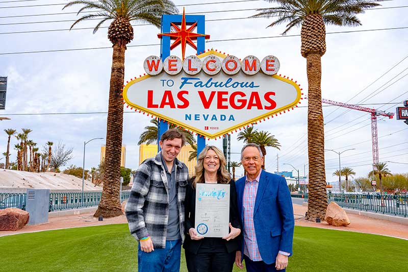 Grant and Lynda at the lighting of the iconic Las Vegas sign in orange for Developmental Disabilities Awareness Month.