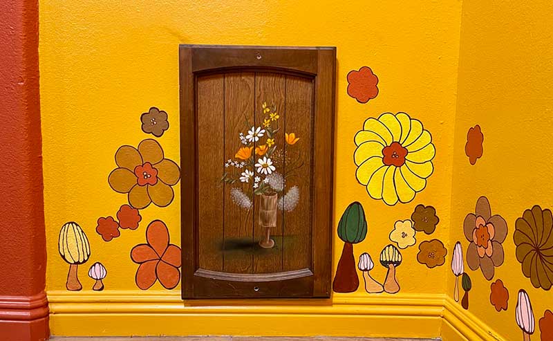 Even canines enjoy groovy hand-painted vibes with their custom door! Photo by Laura Henkel