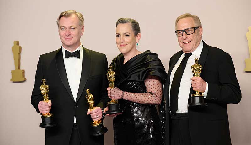 Christopher Nolan, Emma Thomas, and Charles Roven pose backstage with the Oscar® for Best Picture during the live ABC telecast of the 96th Oscars® at Dolby® Theatre at Ovation Hollywood on Sunday, March 10, 2024. Photo by Michael Baker.