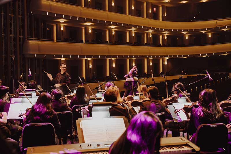 Yunior Lopez conducts the Dia de los Muertos concert. Photo by YAO/Liliana Tejo Vanegas