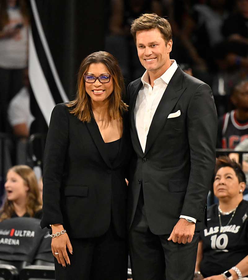 Above: May 14, 2024 Nikki Fargas smiles with Tom Brady pregame. Photo by David Becker NBA Photos.