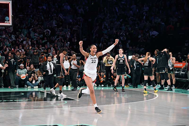 October 18, 2023 WNBA Finals Game 4 - A'ja Wilson celebrating win with raised arms. Photo by Brian Babineau.