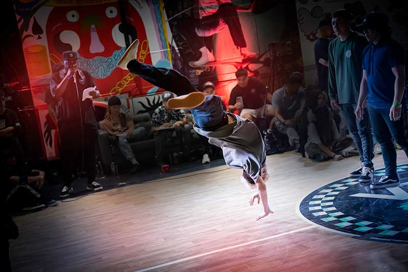 B-boy Lineage, aka Robes Carreira, airborne at In The Circle (ITC) competition. Photo by Elisa Terry Art & Photography