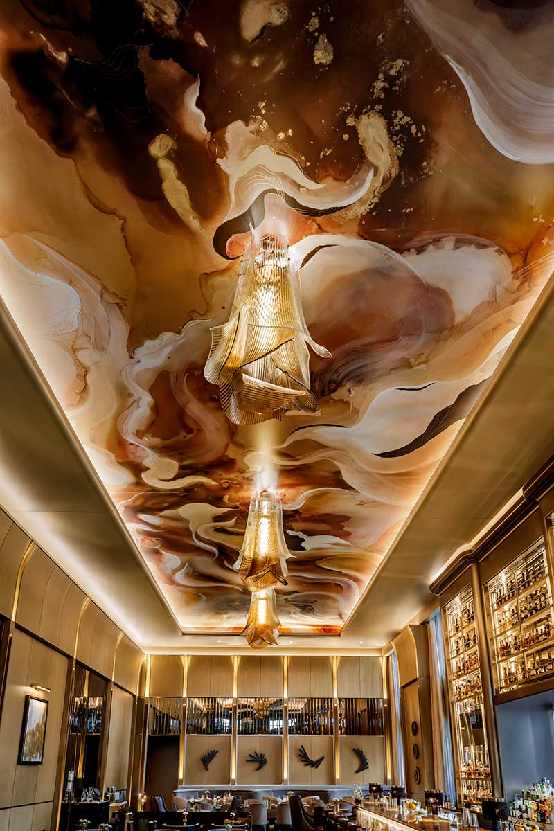 KBAA commissioned an original piece by Toronto artist Madison van Rijn to create a 60 x 19-foot ceiling mural for the St. Regis Toronto. Photo courtesy of KBAA