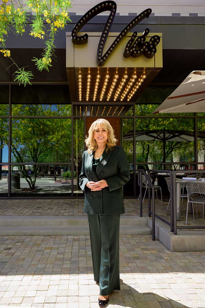 Sue Lowden stands in front of Vic's main entrance.