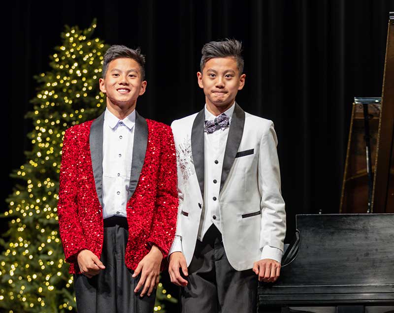 (L-R) Charles and Jun Hong at the 2023 Youth for Youth Holiday Concert. Photo by Devin D Photography