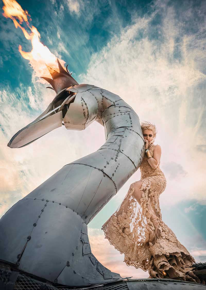 Fashionista Marie Poliak and her art car, The Prodigal Swan, created by Made on Mars. Photo by Cliff Baise