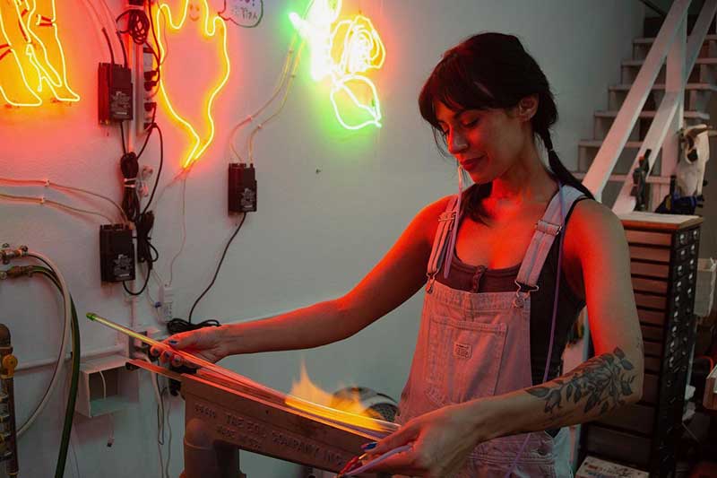 Leticia Maldonado shaping stories through glass and light - where neon becomes poetry in motion. Photo by Róisin Dennis