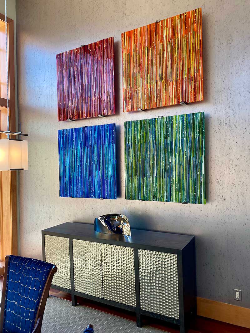 Utah residential “Welcome Blanket” series. Each fused glass panel is 41”x41” in size and created from hot-glass cane work and dichroic glass.