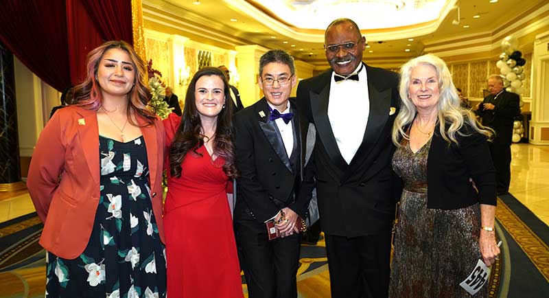 Second from left: Catherine Nielsen, executive director of the Nevada Governor's Council on Developmental Disabilities, and second from right, Peter Whittingham, chair of the board of directors of the Down Syndrome Organization of Southern Nevada