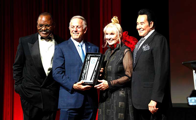 Peter Whittingham, chair of the board of directors of the Down Syndrome Organization of Southern Nevada, Nevada Gov. Joe Lombardo, Linda Smith, and Wayne Newton at the Festival of Trees and Lights gala at the Westgate Las Vegas Resort & Casino on Nov. 12, 2024