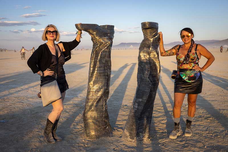 Laura Henkel with Christina Vela, CEO of St. Jude’s Ranch, pictured with Luis Valera-Rico’s piece, Critical Mass, which is an acquisition by the City of Las Vegas and part of their permanent art collection that is now prominently featured in the Arts District near his installation, Radial Symmetry / Photo by Eleanor Preger