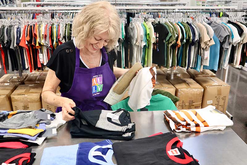 Assisting Lives in Las Vegas member volunteer Patti Kennedy at Our School Boutique