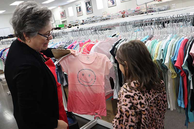 Assisting Lives in Las Vegas member volunteer Lisa Hyde at Our School Boutique