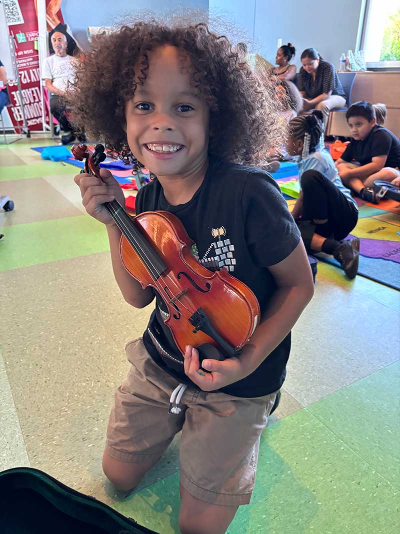 Christafer Mitchell joyfully hugs his new best friend