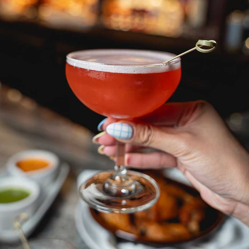 Enjoy a specialty cocktail at Mae Daly's Fine Steaks & Whiskeys
