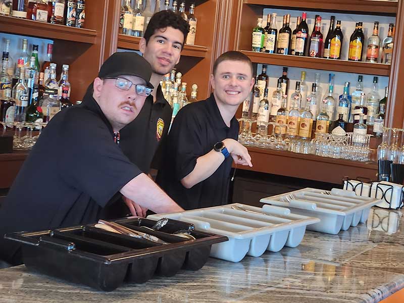 Three participants in Mae Daly's Fine Steaks & Whiskeys vocational training program