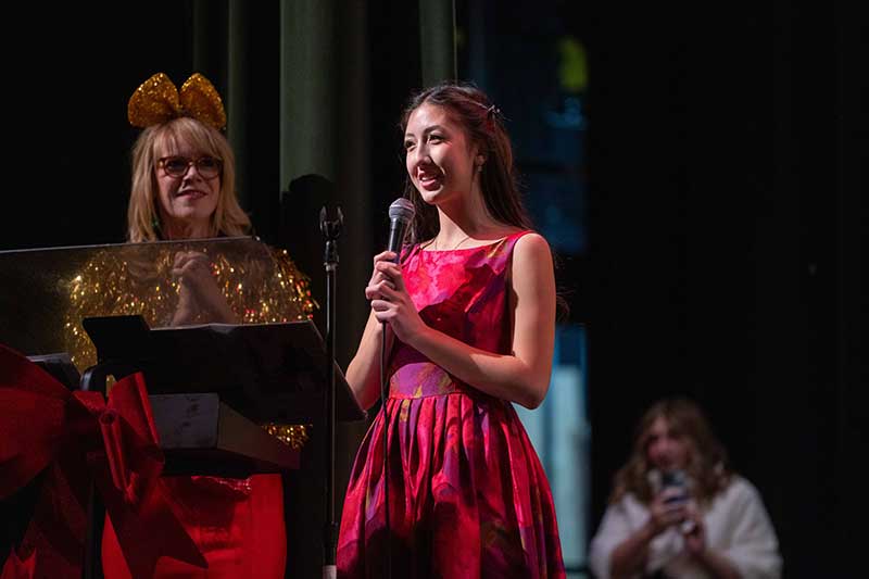 Roxy Jones addresses the audience at the 2024 Youth for Youth Holiday Concert / Photograph courtesy of Cashman Photo