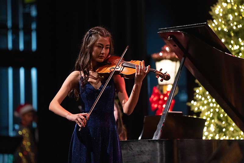 Skai Jones performs on the violin during the 2024 Youth for Youth Holiday Concert. Photograph courtesy of Cashman Photo