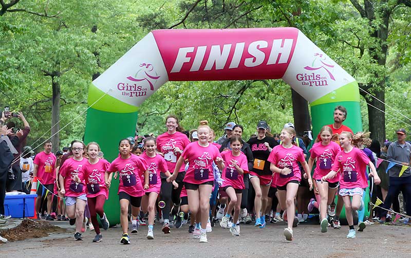 Crossing the finish line for a national Girls on the Run 5K
