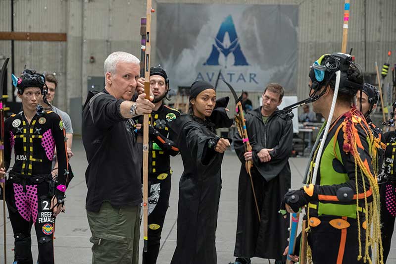 (L-R) Director James Cameron and Zoe Saldaña on the set of 20th Century Studios' AVATAR: FIRE AND ASH. Photo by Mark Fellman. © 2024 20th Century Studios. All Rights Reserved.