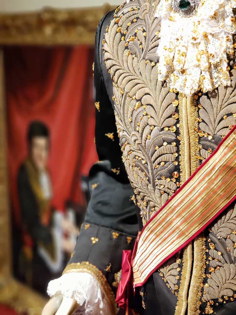 Liberace's 1971 Czar Nicholas costume, designed by Frank Acuna, is displayed in front of a 1972 painting of the entertainer wearing it and is said to have heavily influenced Michael Jackson