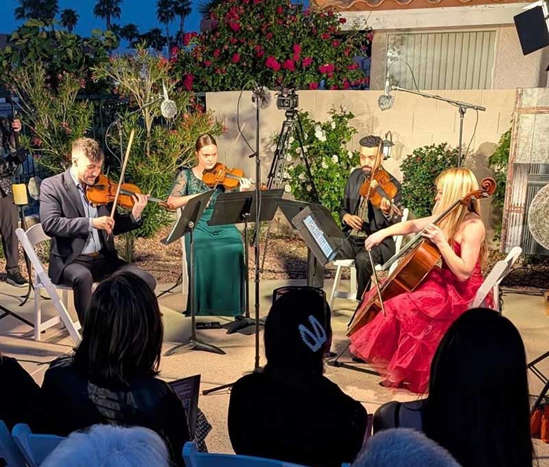 The outdoor concert opened with a string quartet featuring Scott Jackson, Grace Wride, Omar Shelly and Lindsey Springer