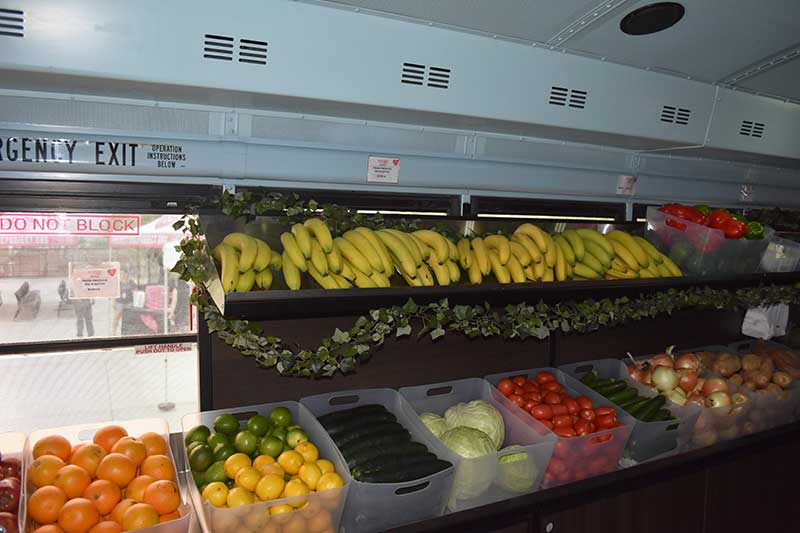 Groceries-on-the-Go-interior Bright pink on the outside and stocked with fresh food on the inside, The Just One Project's Groceries on the Go is designed to serve seniors, working families and others in neighborhoods with limited access to grocery stores