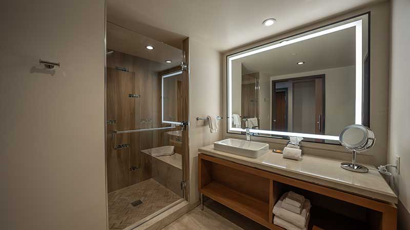 The bathrooms in the East Tower’s modern guest rooms feature spacious, sauna-like showers that will make guests feel like they’re at the spa The bathrooms in the East Tower’s modern guest rooms feature spacious, sauna-like showers that will make guests feel like they’re at the spa