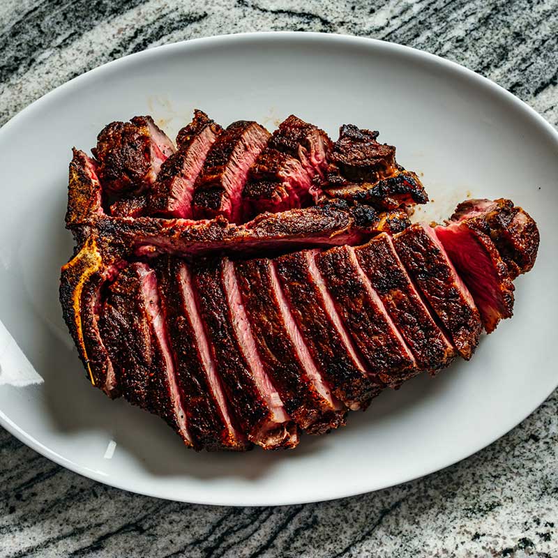 Mae Daly’s Fine Steaks & Whiskeys offers a charcoal-grilled steak, sliced and ready to be enjoyed before the show