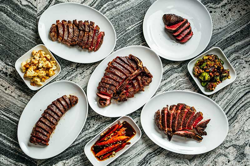 At Mae Daly’s Fine Steaks & Whiskeys, it’s all about beautifully grilled steaks, bold flavors and dishes including perfectly seared cuts to crave-worthy sides