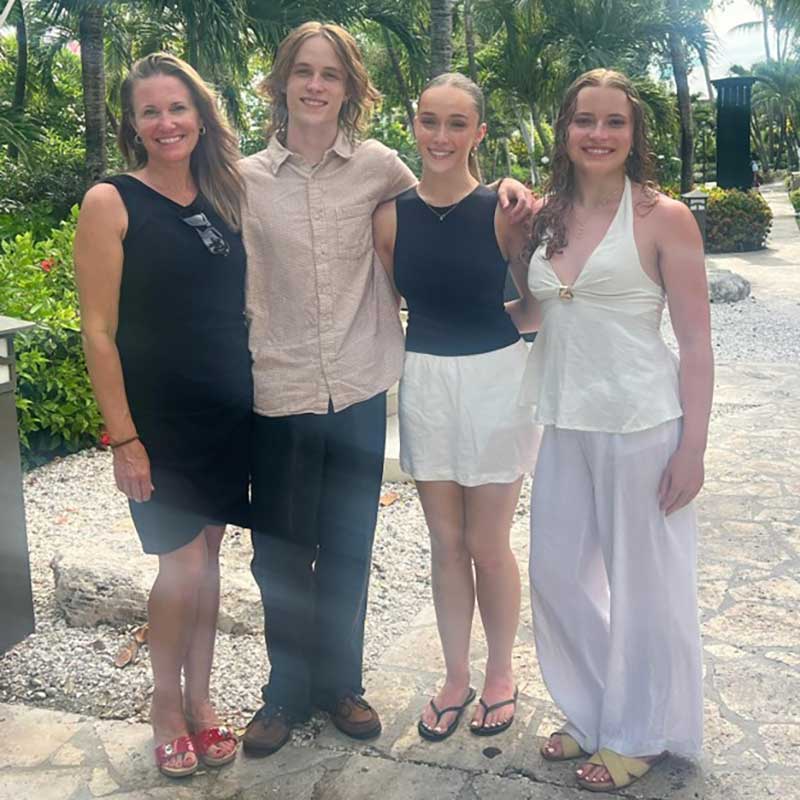 Jennifer Randall Young with her three children, a reminder that success means making time for the people she loves